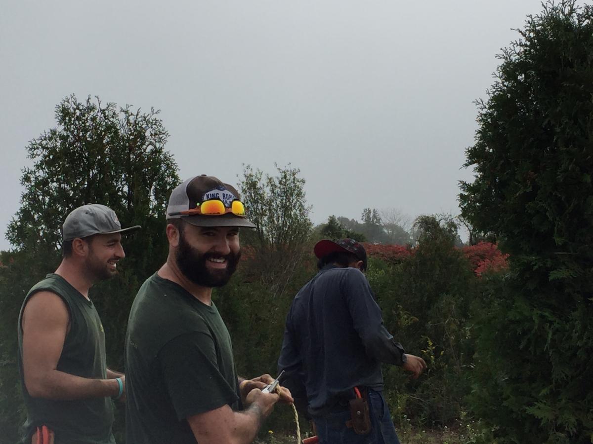 Trevor and Gus are enjoy the group activity in Middletown RI.  We transplanted lots of plants, including: Boxwoods, Yews, Rhododendrons, Arborvitaes, Winterberry and more.